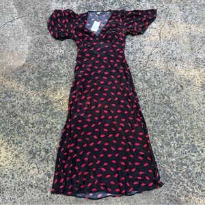 black puff sleeve maxi dress flowy kiss patterned Valentine’s Day date outfit